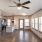 Large well lit living room with wood floors 